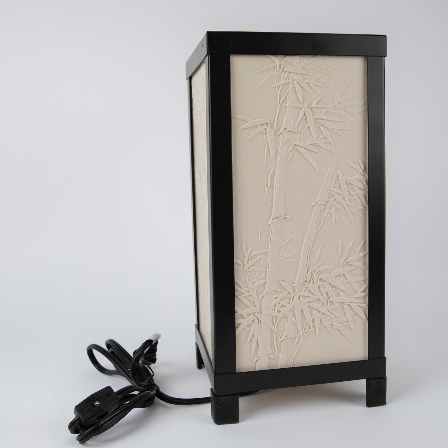 Table lamp with bamboo design on a white background