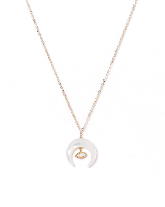 Moon pendant on a gold chain.