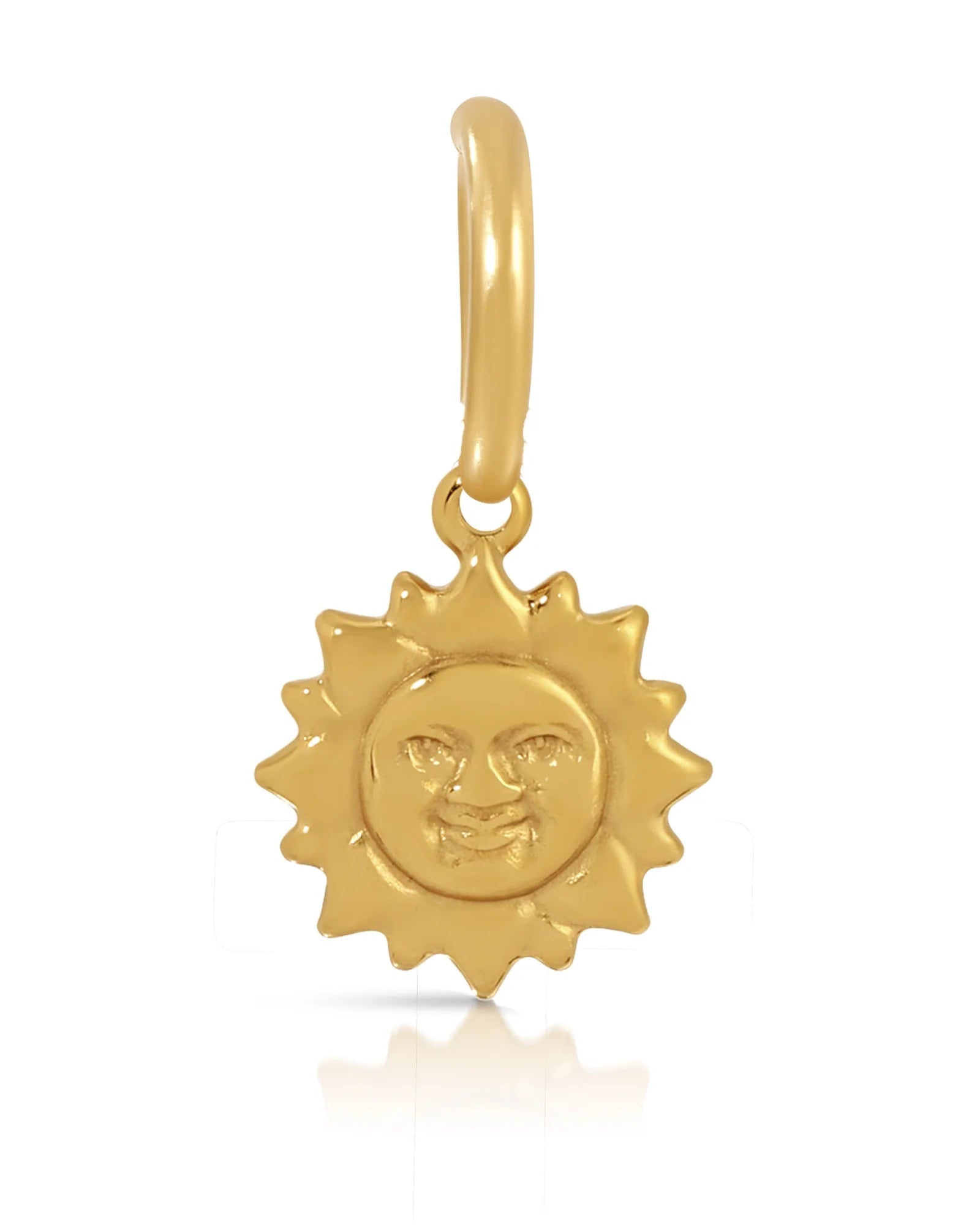 A gold-colored charm pendant featuring a black and white Yin Yang symbol design.