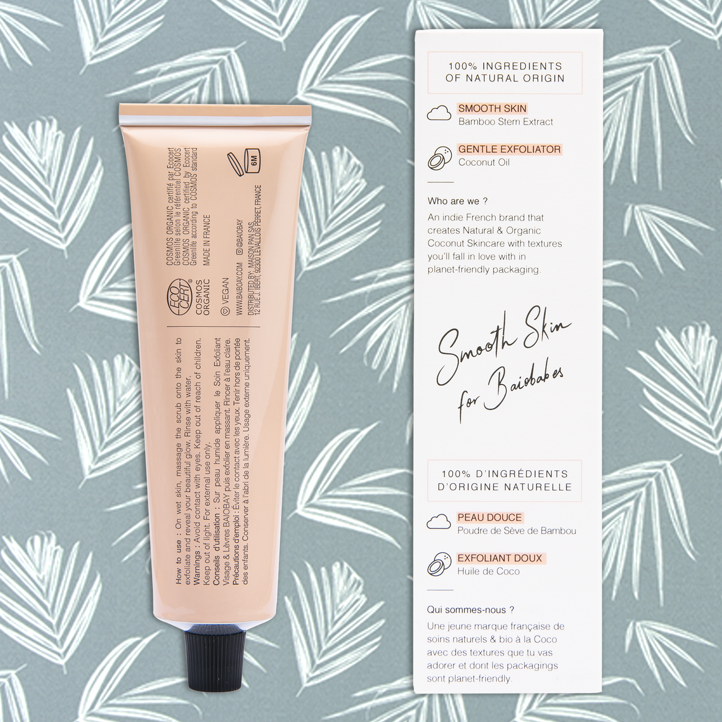 Back side views of BAIOBAY Coconut Oil Face & Lips Exfoliating Scrub tube and box, side by side on a botanical backdrop.