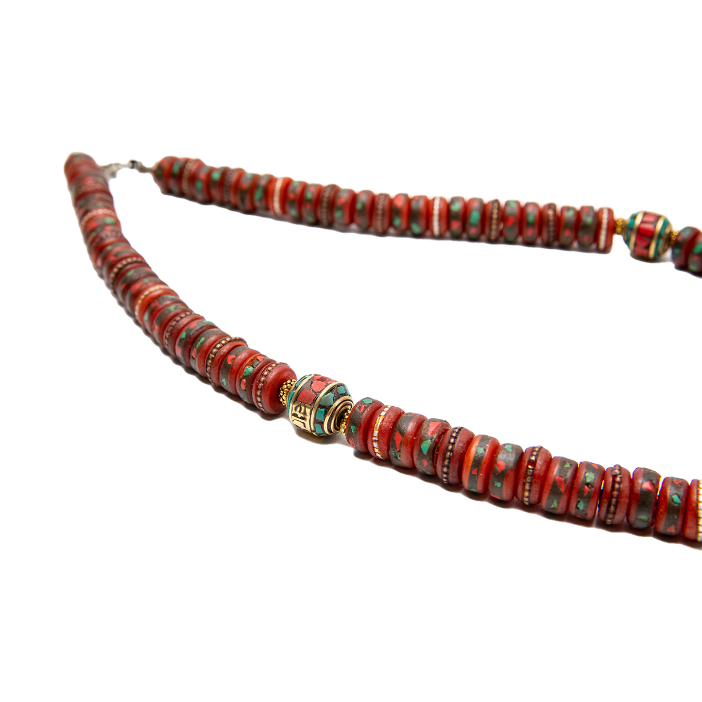 Close up of the beads of the Yak Bone Necklace with Skull Pendant against a white backdrop.