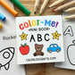 A children's mini coloring book titled 'Color-Me! Mini Book ABC' shown on a wooden surface with colored pencils and other coloring pages around it. The cover features colorful title text, yellow stars, an apple, a teddy bear, and a blue car.