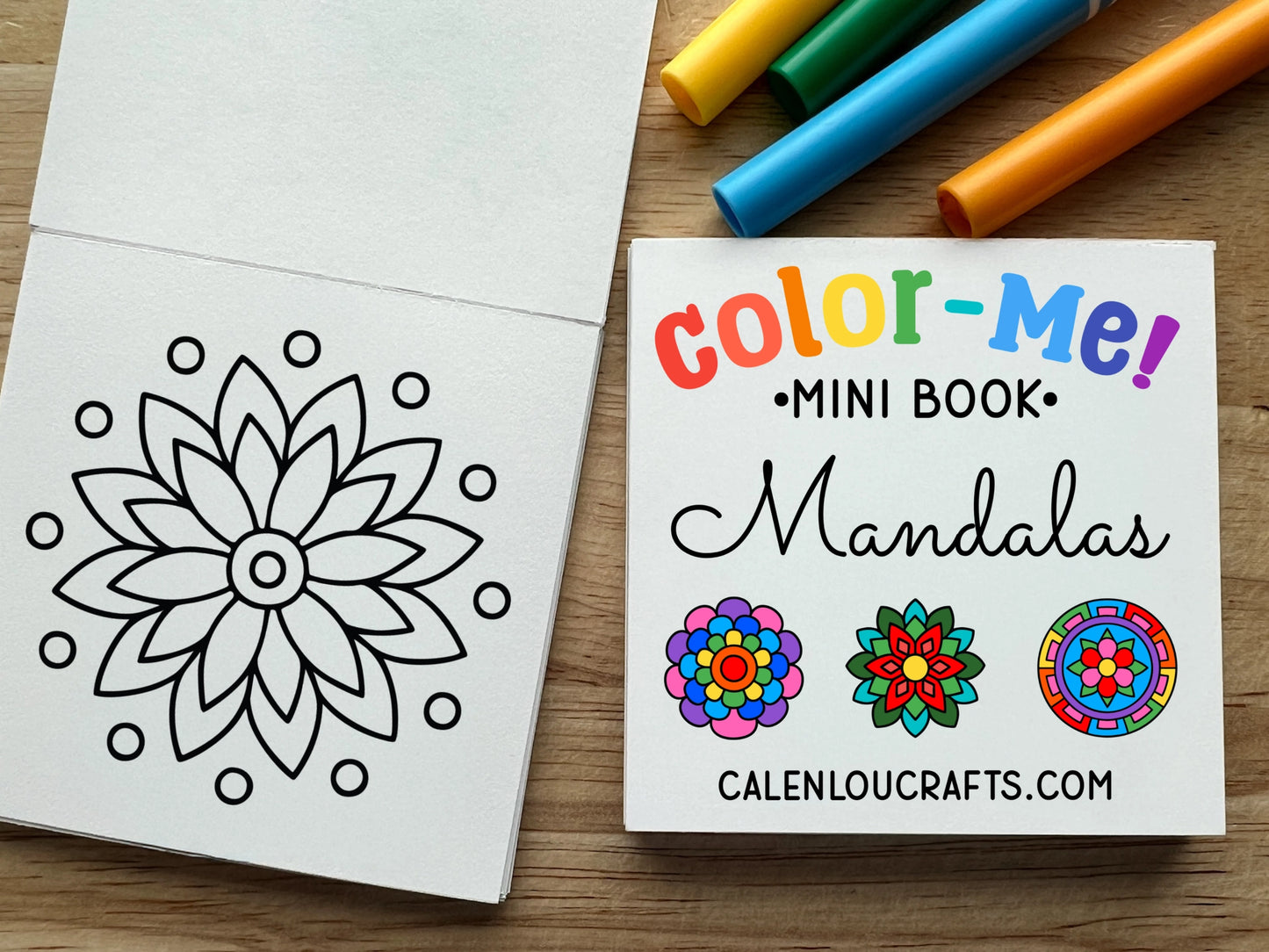 Color-Me! Mini Book Mandalas with markers on a wooden surface
