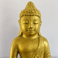 Detail image of a gold colored buddha.