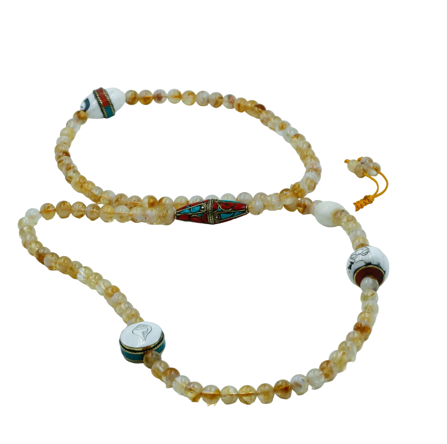 Citrine mala with decorative elements on a white background