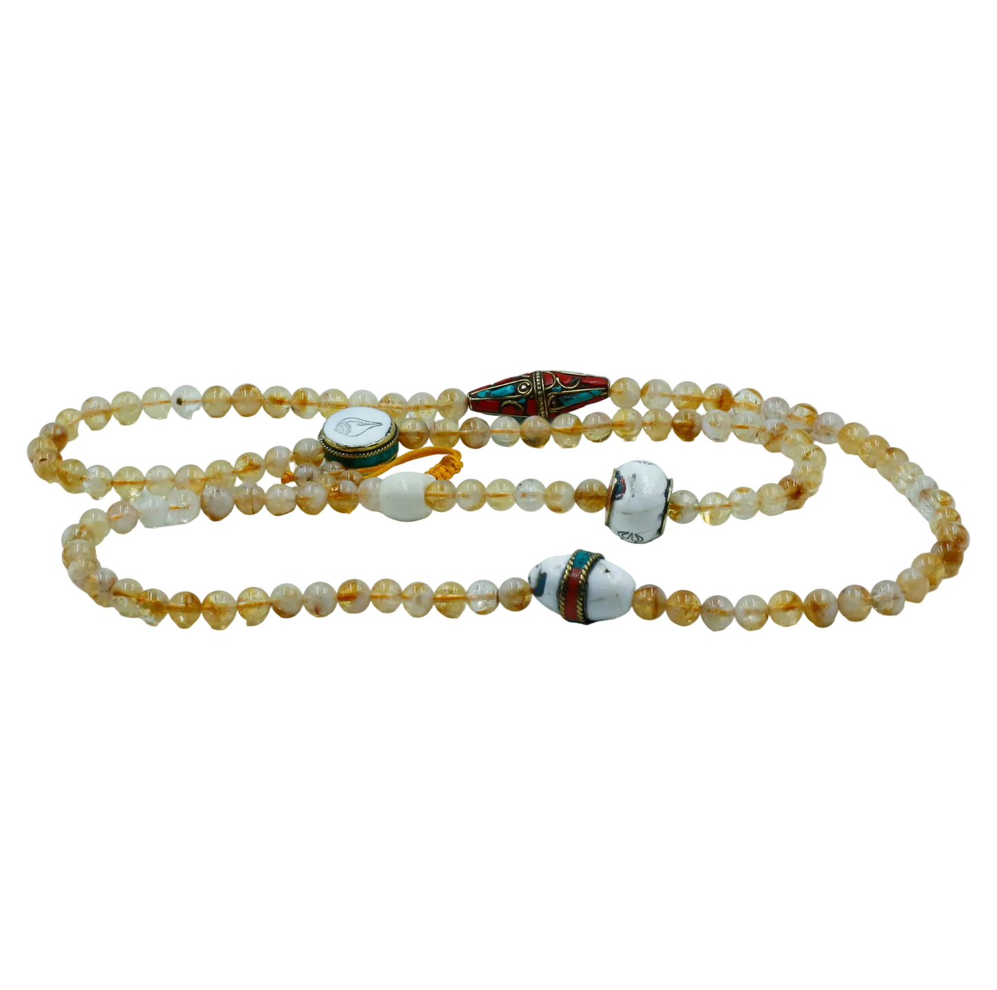 Citrine mala and decorative elements on a light gray background