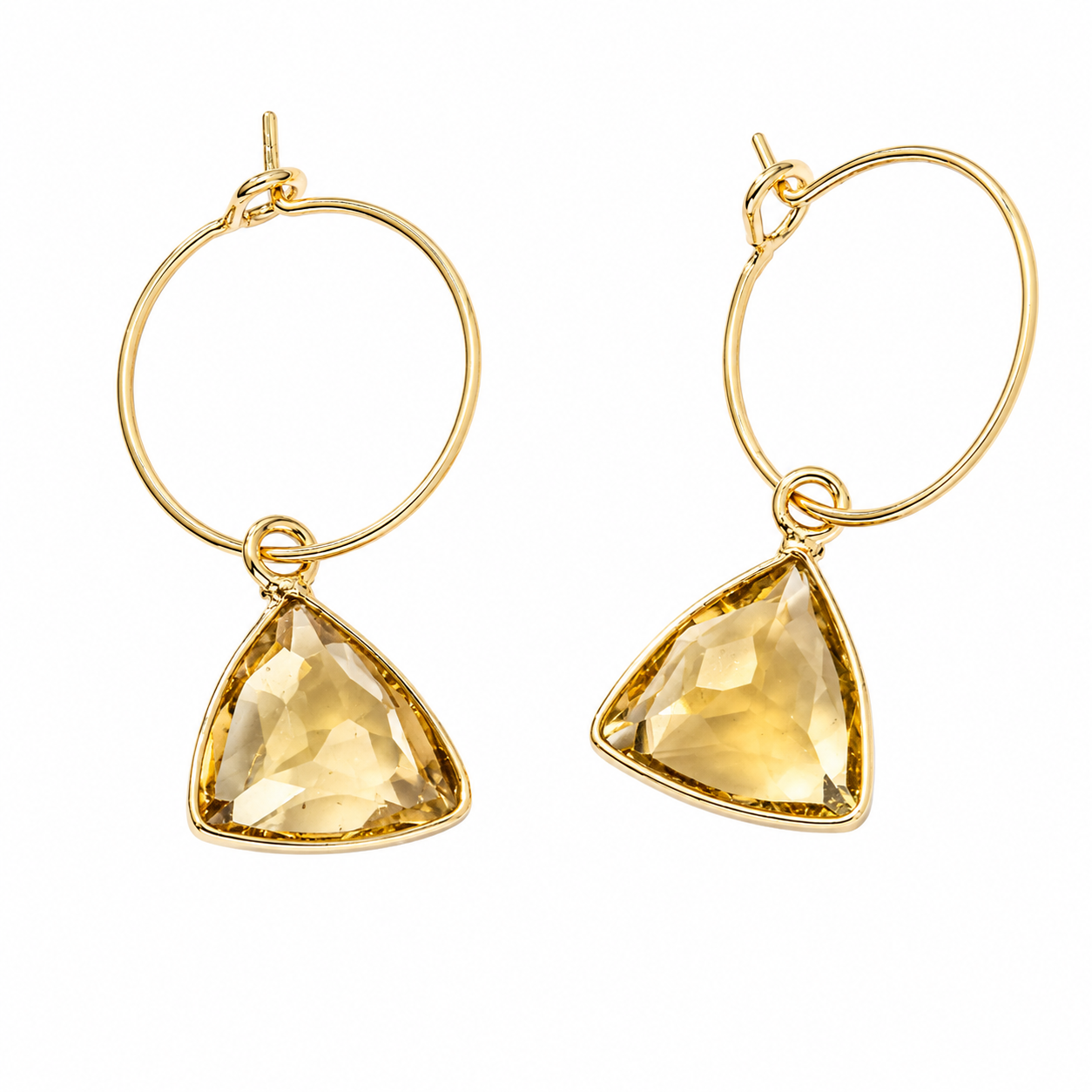A pair of gold hoop earrings with triangular faceted yellow gemstone pendants, shown on a plain white background.