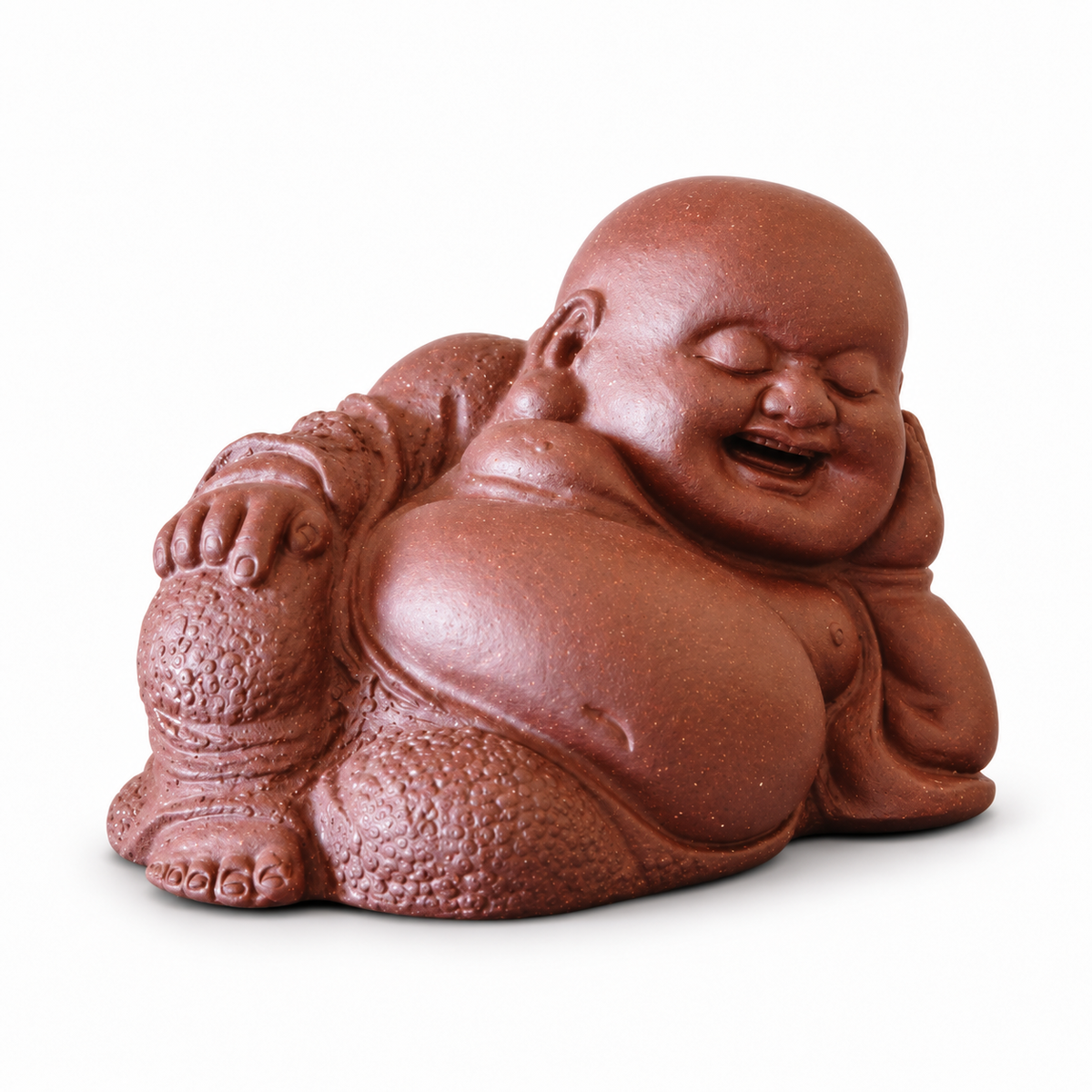 A reddish-brown ceramic figurine of a smiling, reclining Buddha on a plain white background.