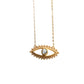 Gold necklace with eye pendant on a white background.