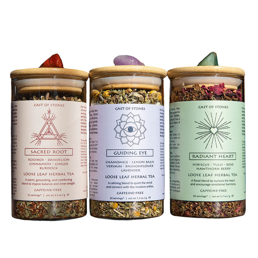 Three jars of herbal tea with labels on a white background