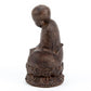 Jizo Statue Sitting On A Lotus