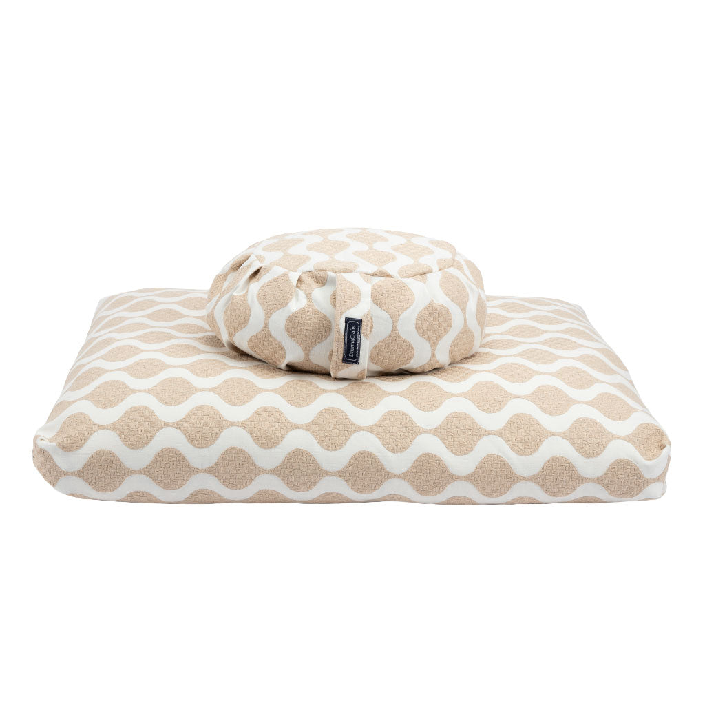 Beige and white patterned zabuton and zafu on a white background