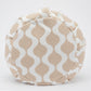 Textured zafu with wavy pattern on a white background