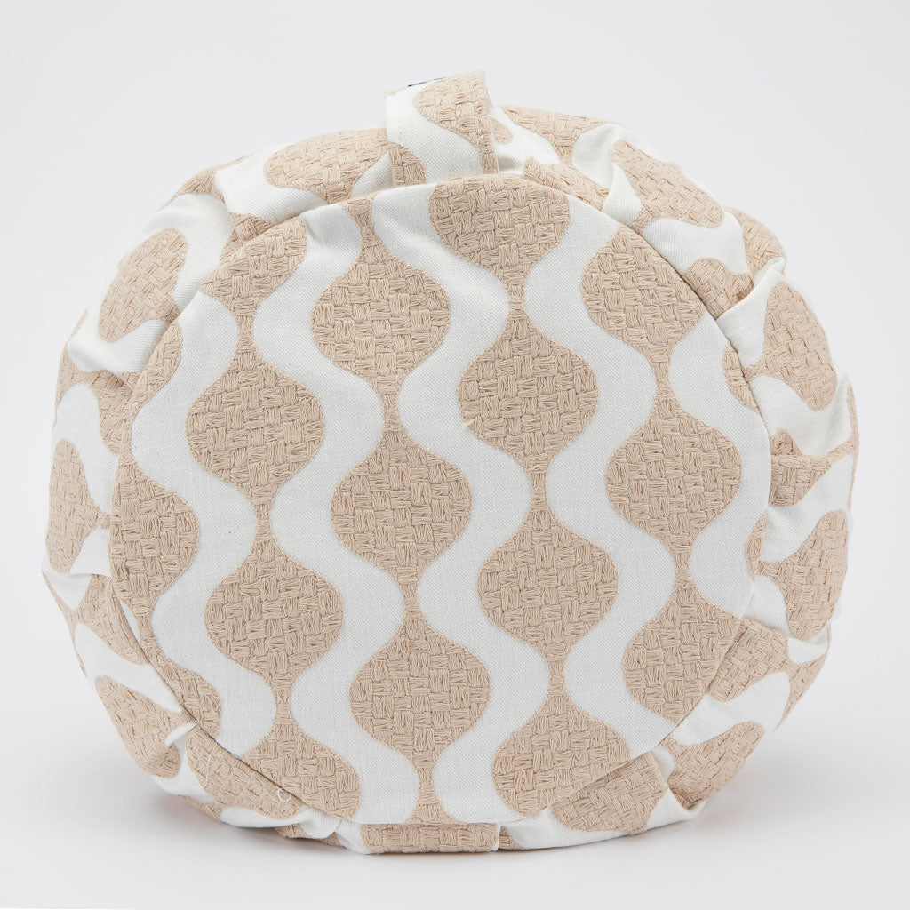 Textured zafu with wavy pattern on a white background