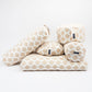 Set of beige and white patterned meditation cushions on a white background