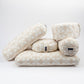 Stack of patterned pillows on a white background