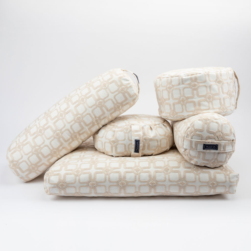 Stack of patterned pillows on a white background