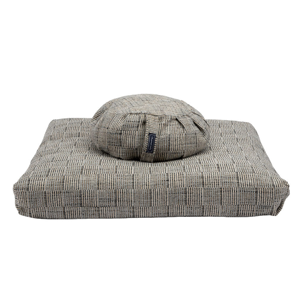 Gray zabuton and zafu cushion on a white background