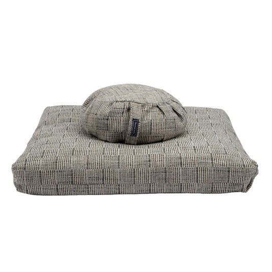 Gray zabuton and zafu cushion on a white background