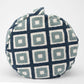 Round pillow with geometric pattern on a white background