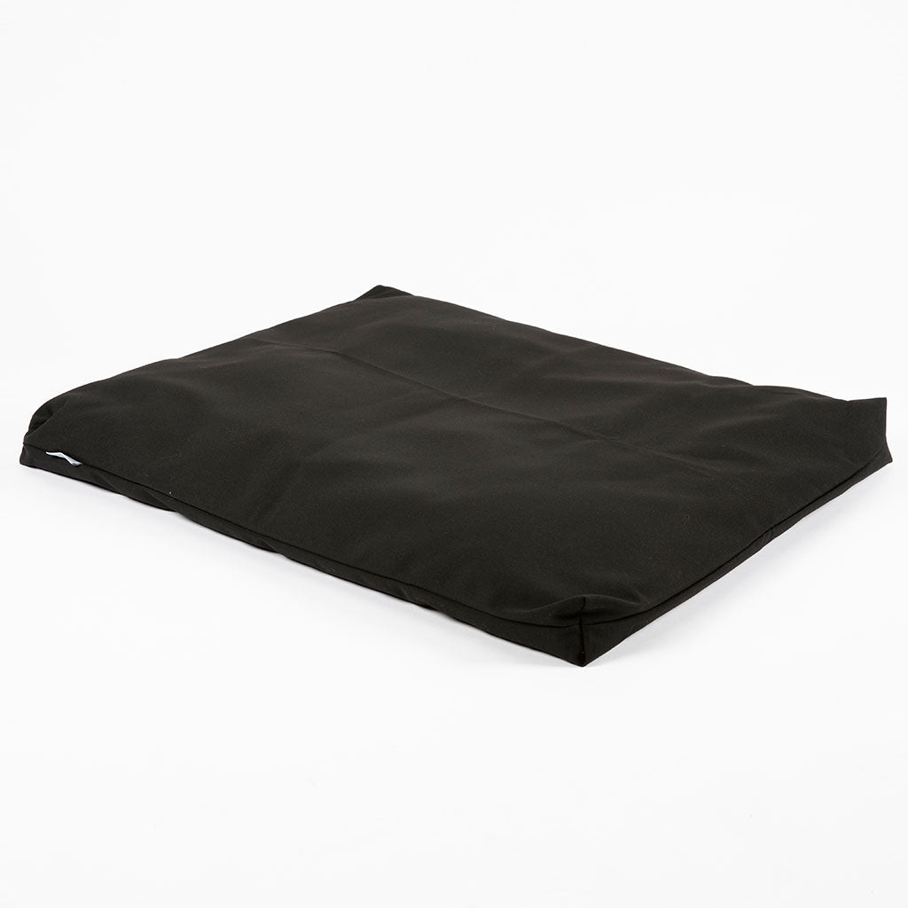 A black rectangular floor cushion or bean bag chair with a matte fabric finish, shown at an angle on a plain white background.