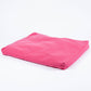 A bright pink rectangular floor cushion or meditation pad with a smooth fabric surface, photographed on a seamless white background.