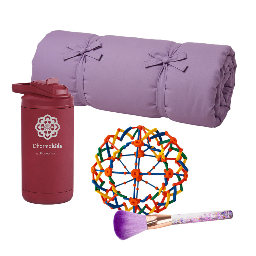 Purple rolled-up yoga mat, maroon tumbler with logo, colorful ball, and makeup brush on a white background