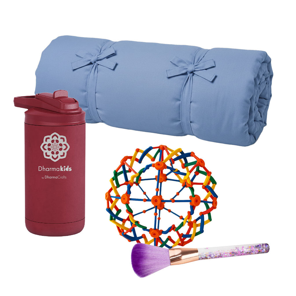 Blue rolled-up yoga mat, maroon tumbler with logo, colorful ball, and makeup brush on a white background