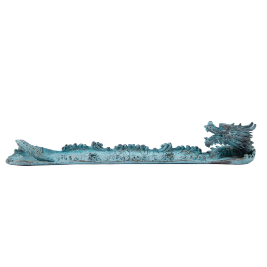 A decorative dragon boat figurine with a weathered turquoise-green patina, featuring a detailed dragon head at the prow and wave-like patterns along the sides, set against a plain white background.