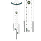 Decorative wind chime with green and silver stones on a white background