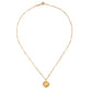 Gold necklace with a sun pendant on a white background.
