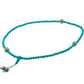 Turquoise beaded mala with decorative elements on a white background
