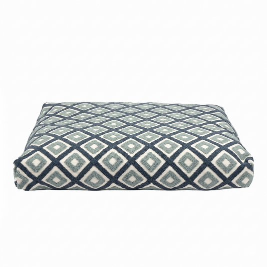 Patterned rectangular cushion on a white background