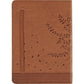 Brown leather notebook with embossed leaves on a white background