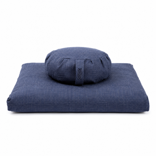 A navy blue meditation cushion set featuring a square floor cushion and a round bolster pillow, both made from a textured woven fabric, shown on a plain white background.
