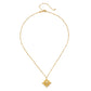 A delicate gold chain necklace with a small circular pendant featuring a central clear stone and surrounding gold detailing, displayed on a clean white background.