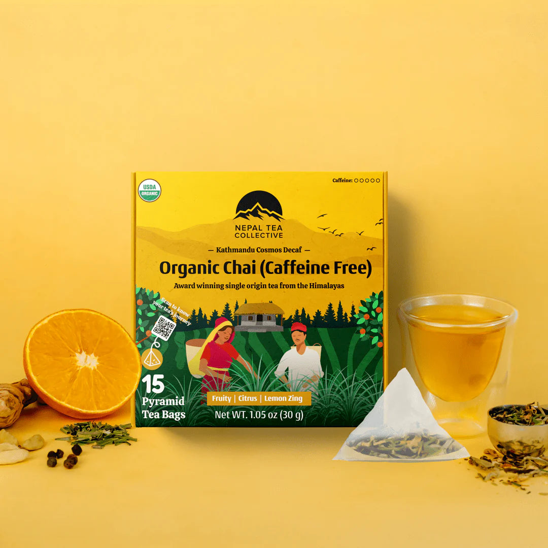 Nepal Tea Collective Organic Chai tea package with a cup of tea and tea leaves on a yellow background