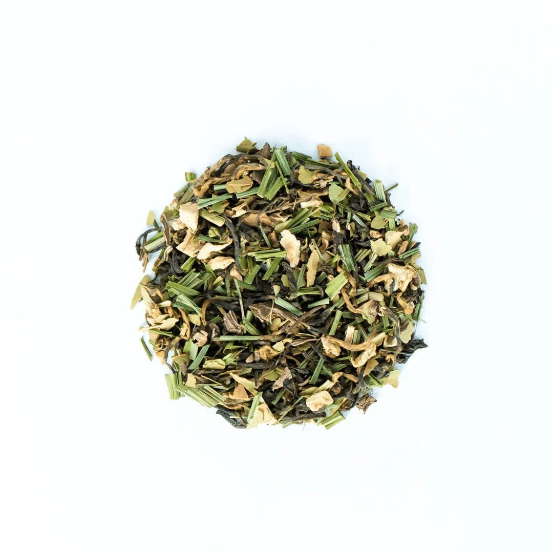 Ball of green herbal tea leaves on a white background