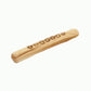 Wooden rolling pin with engraved design on a white background
