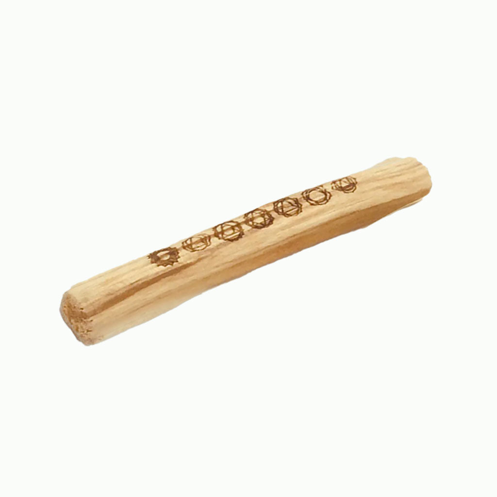 Wooden rolling pin with engraved design on a white background