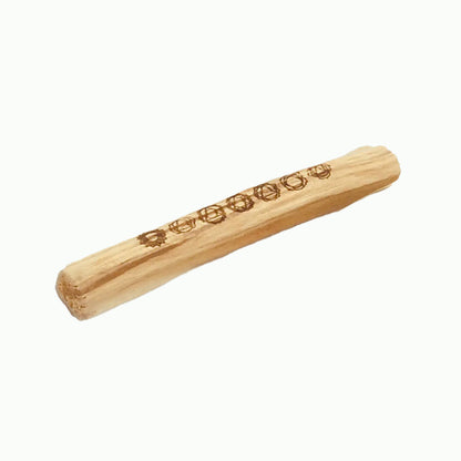 Wooden rolling pin with engraved design on a white background