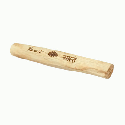 Wooden rolling pin with 'Namasté' engraving on a white background
