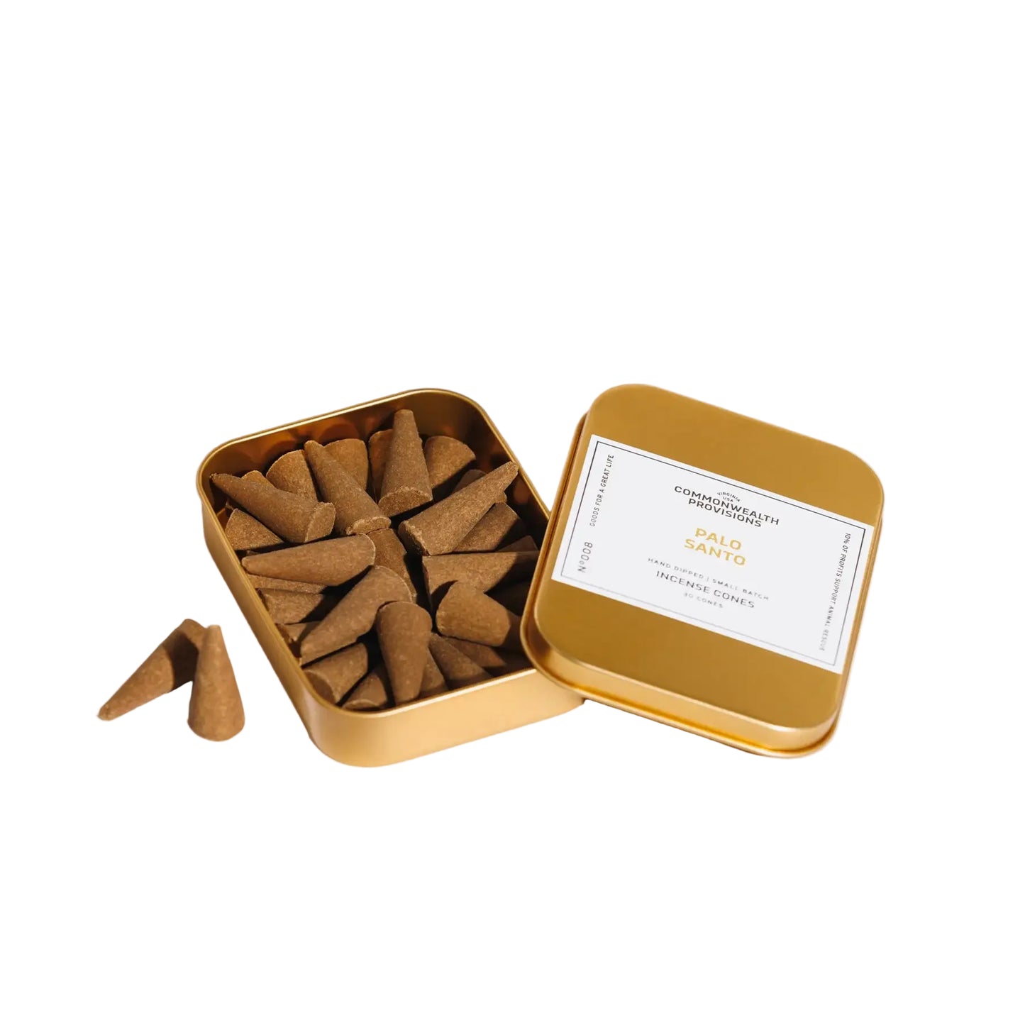 Open gold tin filled with incense cones on a white background