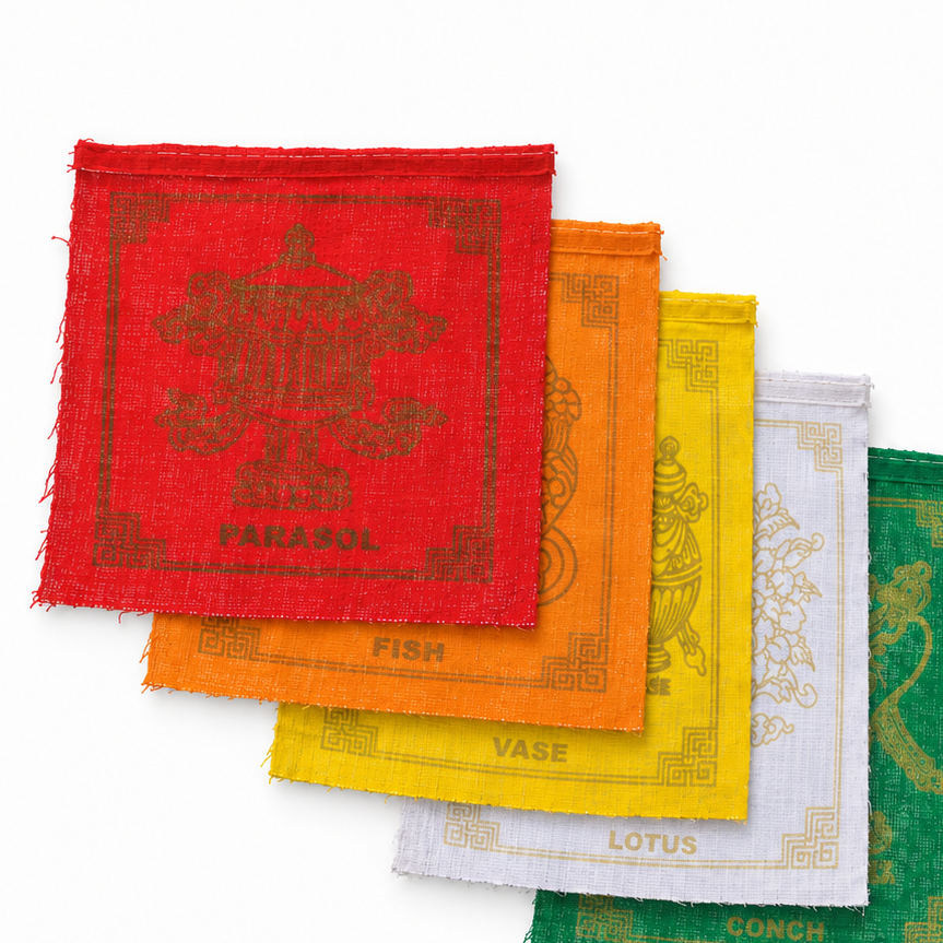 Seven square woven prayer flags in a diagonal stack, showing red, orange, yellow, white, green, blue, and purple colors with gold printed symbols and text on a white background.