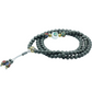 Gray beaded mala bracelet with colorful accents on a white background