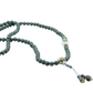 Pyrite mala necklace with decorative elements on a white background