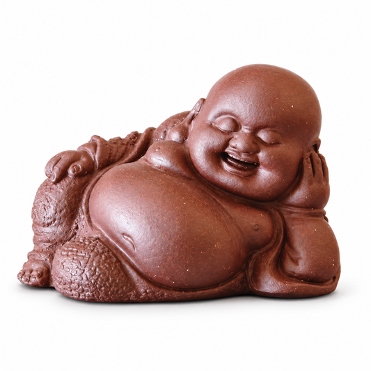A smiling Buddha figurine in a reddish-brown terracotta color, shown on a plain white background.