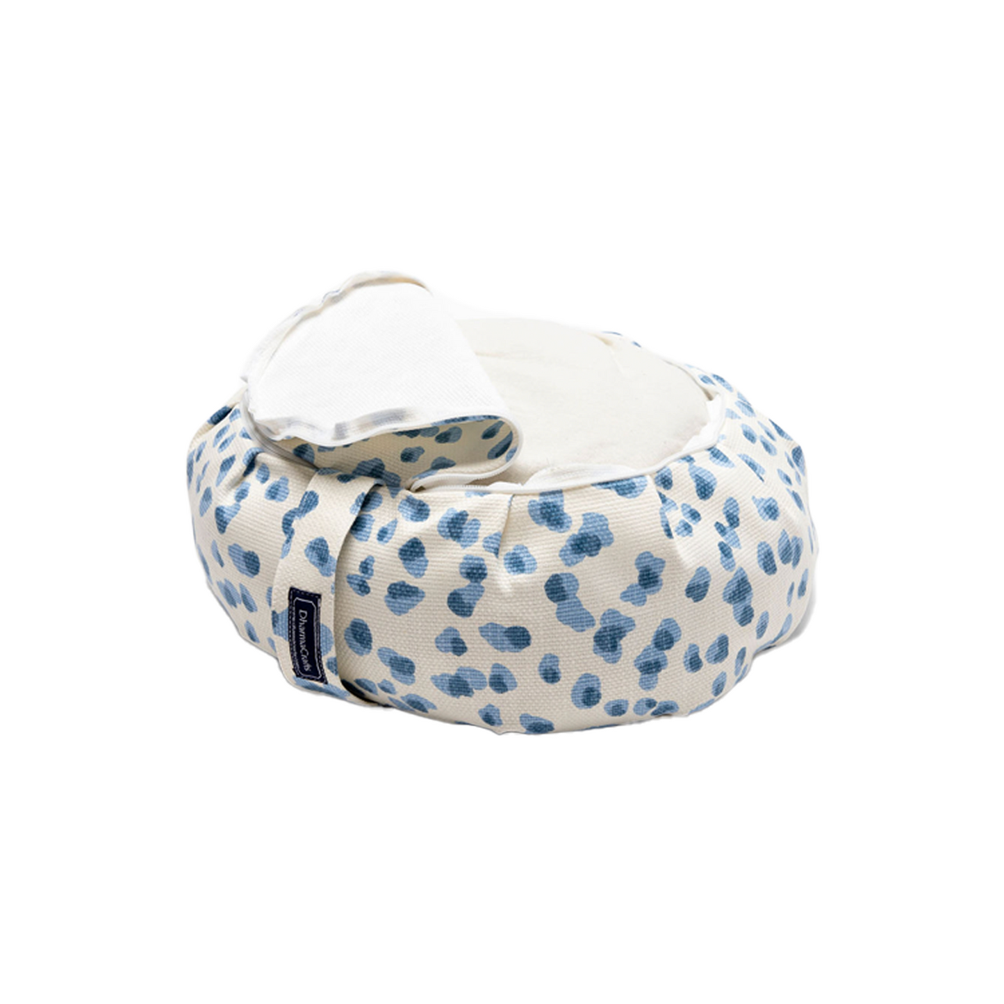 Polka Dot Zafu on white backdrop. The cover is unzipped and folded back partially to show the cushion inside.