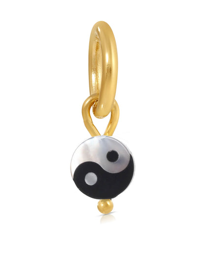 A gold-colored charm pendant featuring a black and white Yin Yang symbol design.
