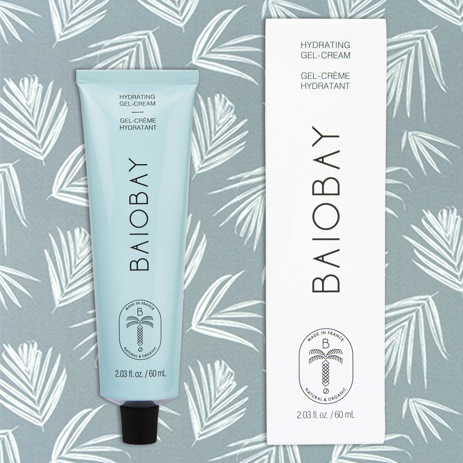 Front side views of BAIOBAY Coconut Oil Moisturizer tube and box, side by side on a botanical backdrop.